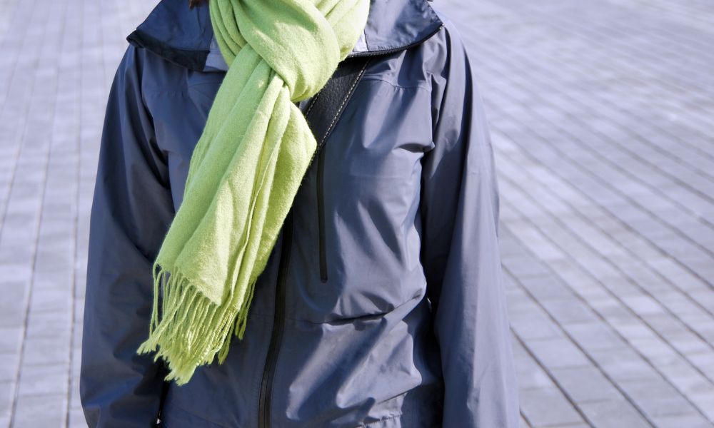 person wearing a scarf with jacket